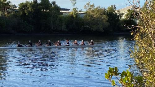 a group of people in a boat on the water at Bli Bli House Riverside Retreat in Twin Waters