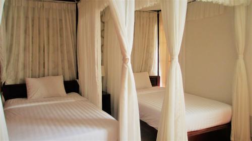 Postel nebo postele na pokoji v ubytování Anh Dao Mekong 2 Hotel