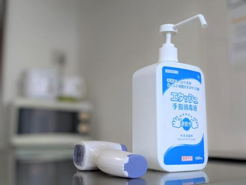 a bottle of toothpaste and a toothbrush on a counter at CIEL BLEU in Tokyo