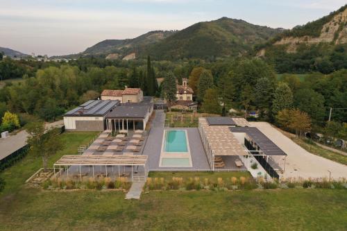 an aerial view of a house with a swimming pool at Corte San Ruffillo Country Resort in Dovadola