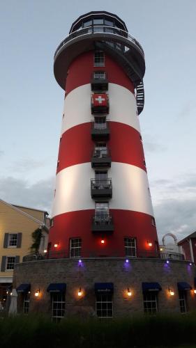 a lighthouse with red and white stripes on it at Ferienwohnung Wölfle in Friesenheim