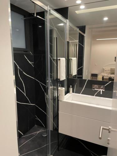 a bathroom with a sink and a mirror at Orpheu Deluxe Apt - Parque das Nações in Lisbon