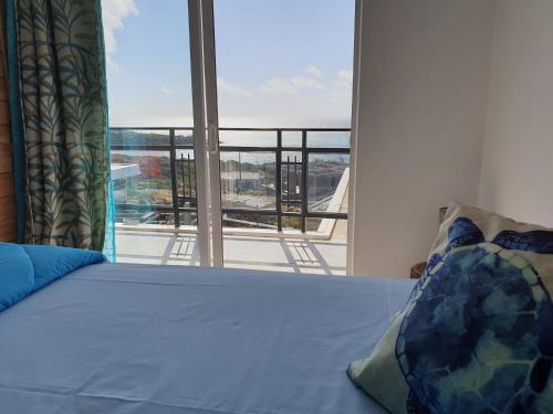Ένα ή περισσότερα κρεβάτια σε δωμάτιο στο Villa Paradise Rodrigues