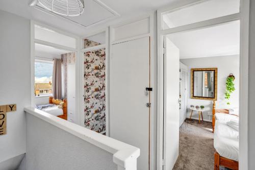 a hallway with a stairway leading to a bedroom at Perfect for Contractors - Canterbury - Free parking - Ultra WiFi in Canterbury