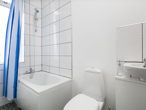 a white bathroom with a toilet and a sink at Shared Short Term South Manchester Accommodation in Manchester