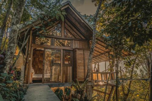 a tree house in the woods at Gumi Ayu EcoStay in Munduk