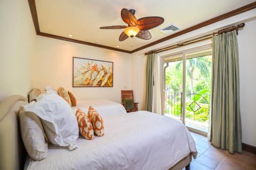 Los Suenos Resort Montebello 2C by Stay in CR tesisinde bir odada yatak veya yataklar