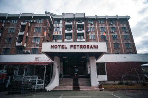a hotel pentagon sign in front of a building at Petrosani Camere de Inchiriat - Hotel Petroshani srl in Petroşani
