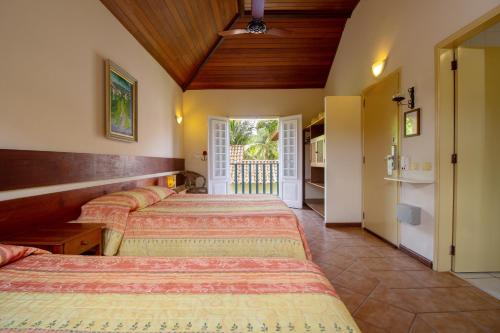 Postel nebo postele na pokoji v ubytování Villas De Paraty