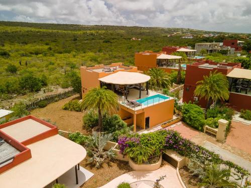 an aerial view of a house with a pool at Villa Pulpoloco in El Pueblo Villas in Kralendijk