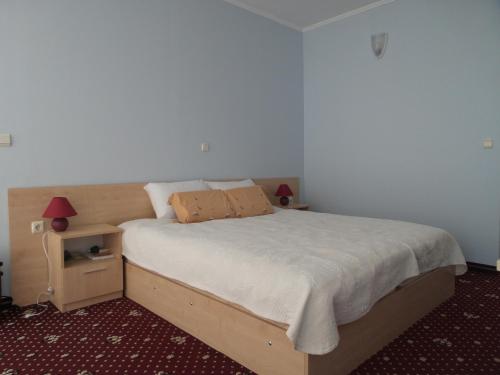 Ένα ή περισσότερα κρεβάτια σε δωμάτιο στο Hotel Paradise