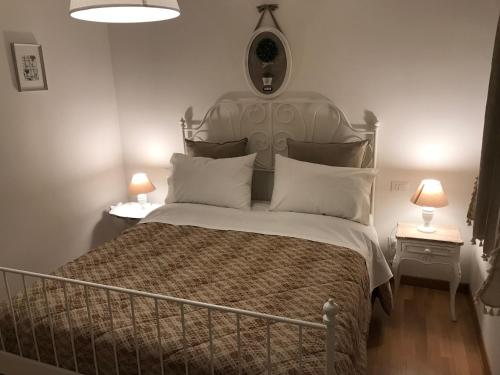 Un pat sau paturi într-o cameră la Appartamento Verde Golf