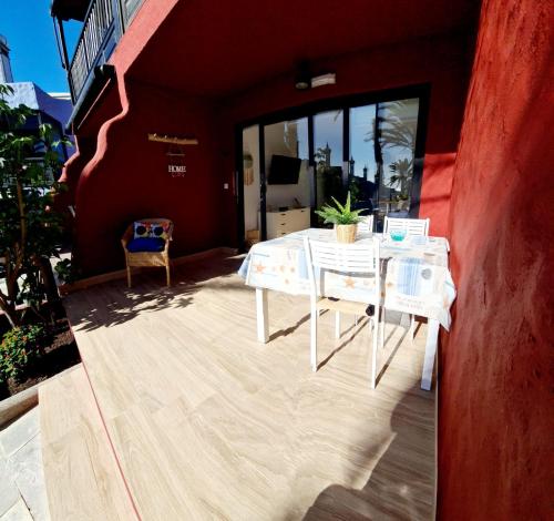 a white table and chairs on a patio at Sea View in Playa del Aguila