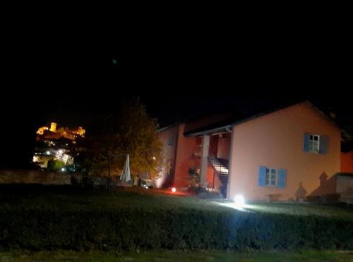 a house at night with its lights on at Agriturismo Cascina Palazzo in Roddi