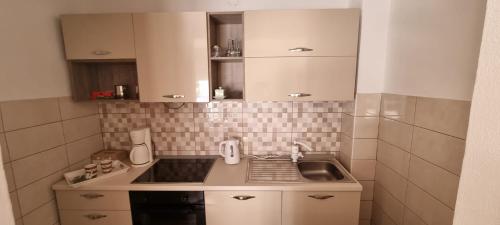 Η κουζίνα ή μικρή κουζίνα στο Apartments Cambellezza