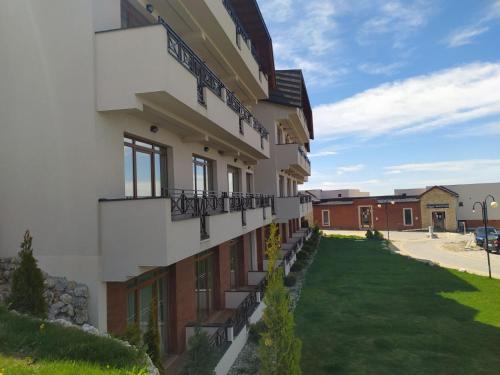 a building with balconies on the side of it at Milmari Premier 13 in Kopaonik