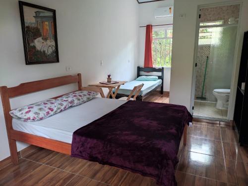 Postel nebo postele na pokoji v ubytování Pousada Sossego da Vila - Trindade Paraty