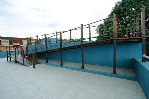 a railing on the side of a blue building at leroy place in Kingston