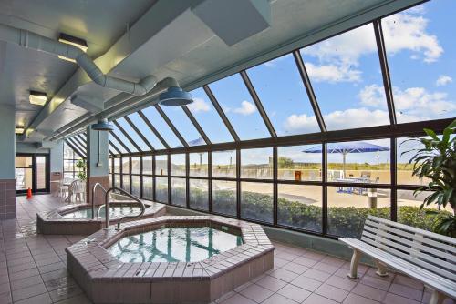 a large building with a hot tub and a bench at Phoenix 6 Unit 1015 in Orange Beach