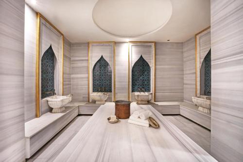a bathroom with two sinks and two toilets at Stargate Hotel&Spa in Korfez