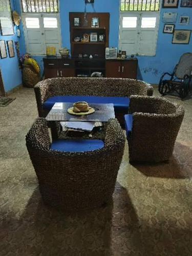 a living room with two chairs and a table at Galerazambahostal in Galerazamba