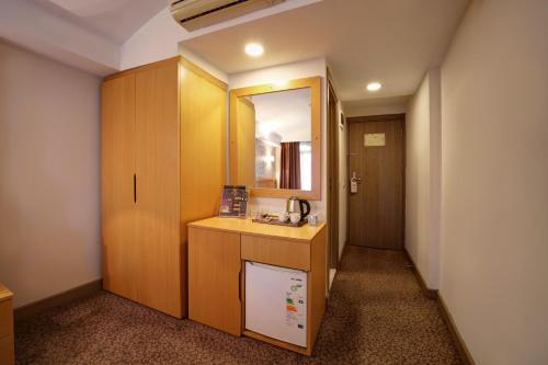 a small bathroom with a sink and a mirror at Stargate Hotel&Spa in Korfez