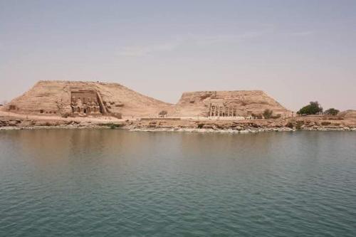 a large hill in the middle of a body of water at Hllol Hotel Abu Simbel in Abu Simbel