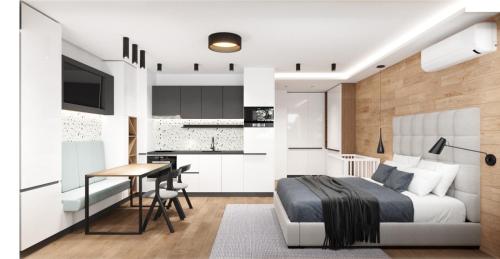 um quarto com uma cama, uma secretária e uma cozinha em LUXURIOUS ONE BEDROOM STUDIO IN TOP CENTER em Blagoevgrad