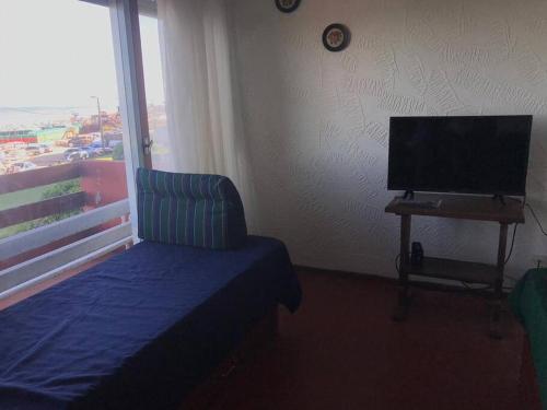 Una televisión o centro de entretenimiento en Edificio Playa Villa Gesell