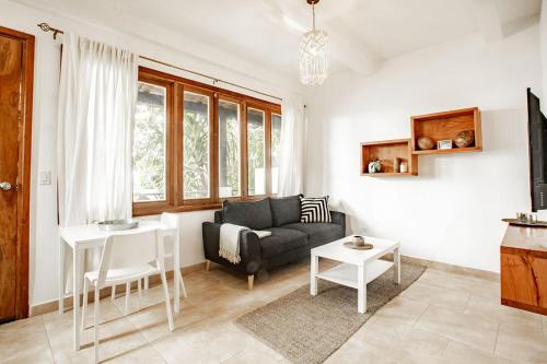 a living room with a couch and a table at Playa Venao Hotel Resort in Playa Venao
