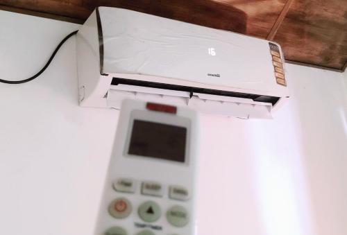 a remote control in a box on a table at Lake Cabin in Polonnaruwa