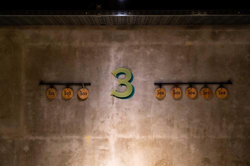 a wall with halloween pumpkins with the number three at TAKAONE ACTIVITY＆STAY in Hachioji