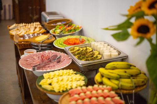 a buffet with many different types of food on a table at Mai Chau Mountain View Resort in Mai Chau