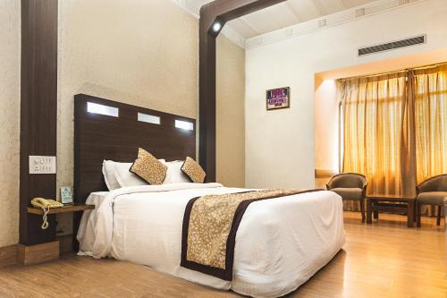 Postelja oz. postelje v sobi nastanitve Hotel Asia Vaishnodevi