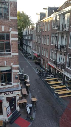 a view of a street with buildings and a street sidx sidx at MICHELLE, not for parties, not a hotel, room with shared bathroom, no kitchen in Amsterdam