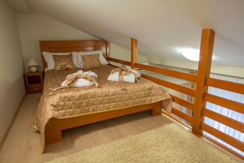 En eller flere senge i et værelse på Apartments Jevtic