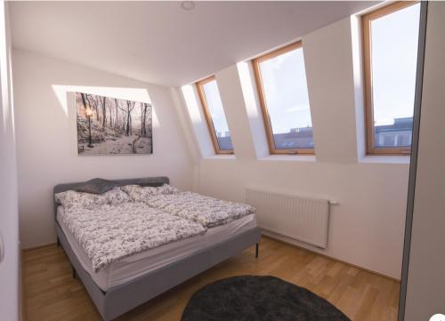 Postel nebo postele na pokoji v ubytování Sunny Penthouse l DG1'14