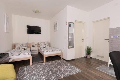 Μια τηλεόραση ή/και κέντρο ψυχαγωγίας στο NunaNina apartmani