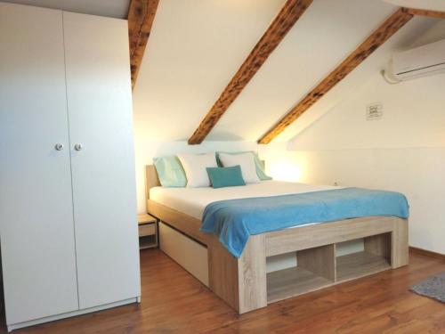 a bedroom with a bed in a attic at Stylish holiday home Lorena in Sveti Juraj