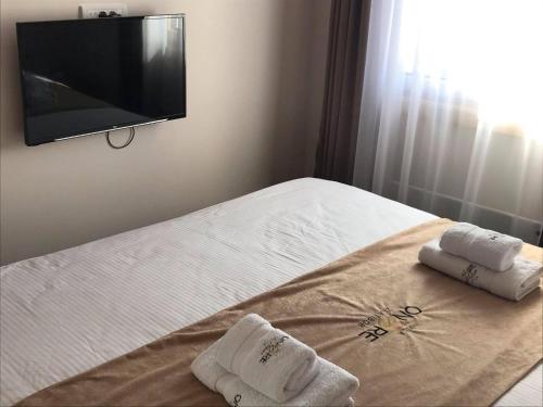 Ein Bett oder Betten in einem Zimmer der Unterkunft Apartman Onore 2