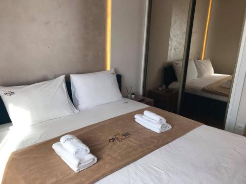 Ein Bett oder Betten in einem Zimmer der Unterkunft Apartman Onore 2
