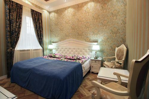 Кровать или кровати в номере Sanata