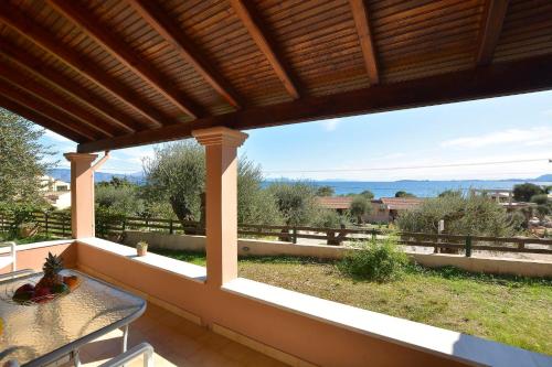a view from the porch of a house with a table at Renata Rooms & Studios in Barbati