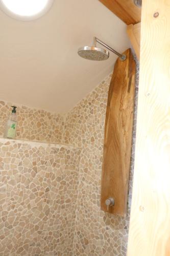 a bathroom with a shower with a wooden tub at Chalet Savoyard Balcon de Villy in Étaux