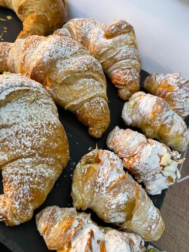 a bunch of croissants sitting on a tray at B&B Il Gigante in Agrigento