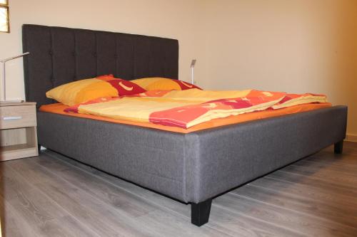 מיטה או מיטות בחדר ב-Ferienhaus Rhönpforte