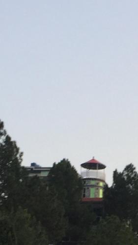 a building with a light in the middle of trees at SWAT HiLL ViEW RESORT-only for families in Swat