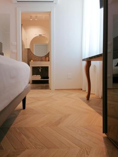 Letto o letti in una camera di Palazzo Cortesi