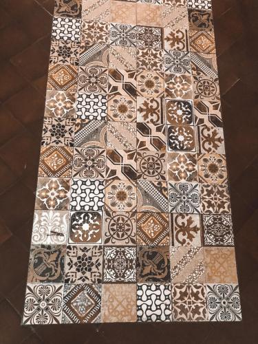 a tiled floor in a room withcoordinated tiles at Asuncion Palace in Asuncion