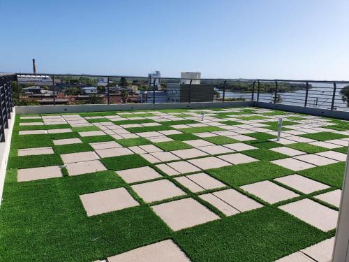a view from the roof of a building with grass at Antique Barraca in Concepción del Uruguay